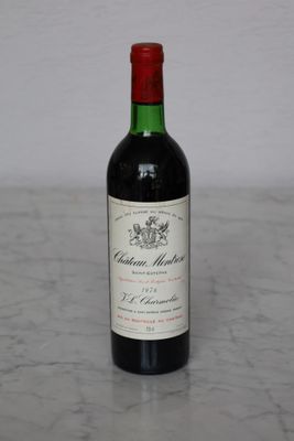 a bottle of wine that is sitting on a table