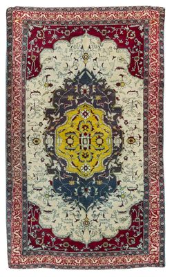 un tapis rouge et bleu à motifs de médaillons