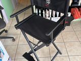a black director ' s chair sitting in a store
