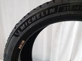 a close up of a tire on a white surface with a white background