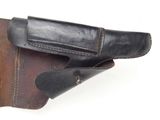 leather holster with a leather belt and a leather sheath