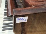 a piano that is on display in a room