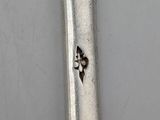 a spoon that has some writing on it