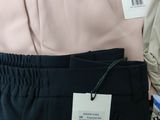two pairs of pants that are on display in a store