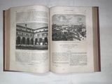 an open book with a picture of a city in it