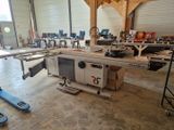 a picture of a table sawing machine in a workshop