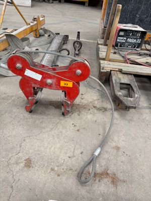 an image of a red pipe cutter in a warehouse