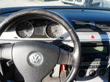 dashboard of a car with a steering wheel and dashboard gauges