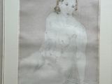 framed drawing of a woman sitting on a bed in a room