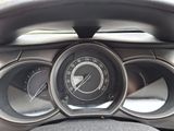 a close up of a car dashboard with a speedometer and gauges