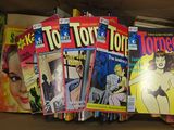 a lot of comic books in a box on the shelf