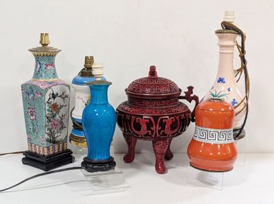 a lot of vases that are sitting on a table