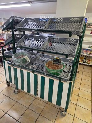 a display case in a grocery store with many items on it