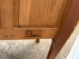 a close up of a piece of wood with a stamp on it