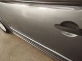 a car door handle with a hole in the side of it
