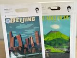 a couple of magazines sitting on top of a wooden table