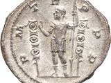 a silver coin with a man holding a sword on top of it