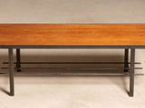 an image of a wooden table with metal legs and a wooden top