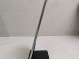 a tablet that is sitting on a stand on a table