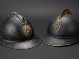 two helmets with a gold star on the top and a silver helmet on the bottom