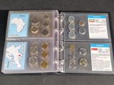 a binder with a lot of different coins in it