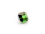 a green tourmaline stone on a white background