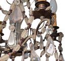 a chandelier that has a bunch of glass beads hanging from it