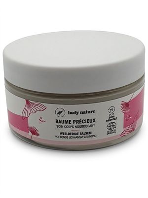 a close up of a jar of body butter on a white surface