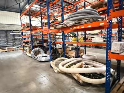 many pipes and hoses on the shelves in the warehouse