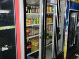 several refrigerators that are lined up in a store