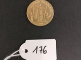 a close up of a coin with a price tag attached to it