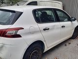 a white car that is parked in a parking lot