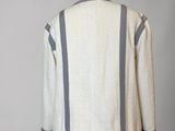 the back of a white and grey sweater on a mannequin dummy
