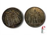 an image of two coins with the image of a man and a woman on them