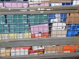 many boxes in a metal cage on the floor