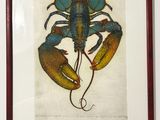 painting of a lobster in a red frame hanging on a wall