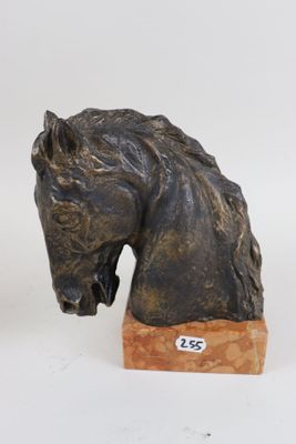 sculpture of a horse head on a wooden base on a white background