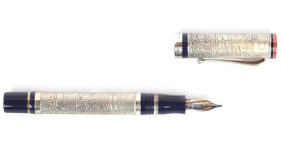 two pens sitting next to each other on a white surface