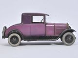 a purple toy car that is sitting on a white surface