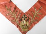 embroidered collar with a cross and a crown on it