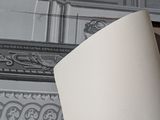 a lamp that is sitting on a table in front of a picture