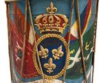 a drum with a crown on it and a flag on the side