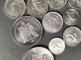 a close up of a bunch of coins sitting on top of a table