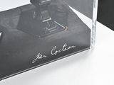 a picture of a picture of a camera in a clear box