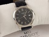 a black watch with roman numerals on it in a box