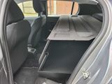 the back seats of a car with a tray in the trunk