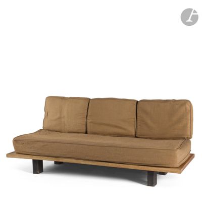 the futon sofa bed is made of wood and has a brown cover