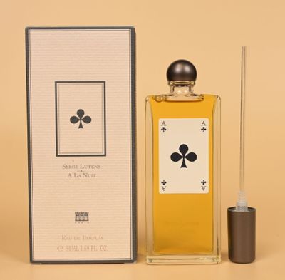 an image of a bottle of perfume sitting next to a box