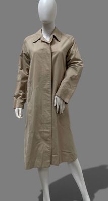 an image of a mannequin dressed in a beige trench coat