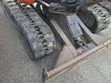 a tractor with a snow plow attached to the front of it